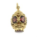 A 9ct gold garnet openwork pendant.