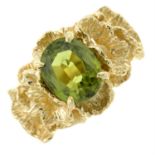 A peridot abstract dress ring.