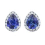 A pair of sapphire and diamond cluster stud earrings.