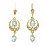 A pair of blue topaz and split pearl drop earrings.