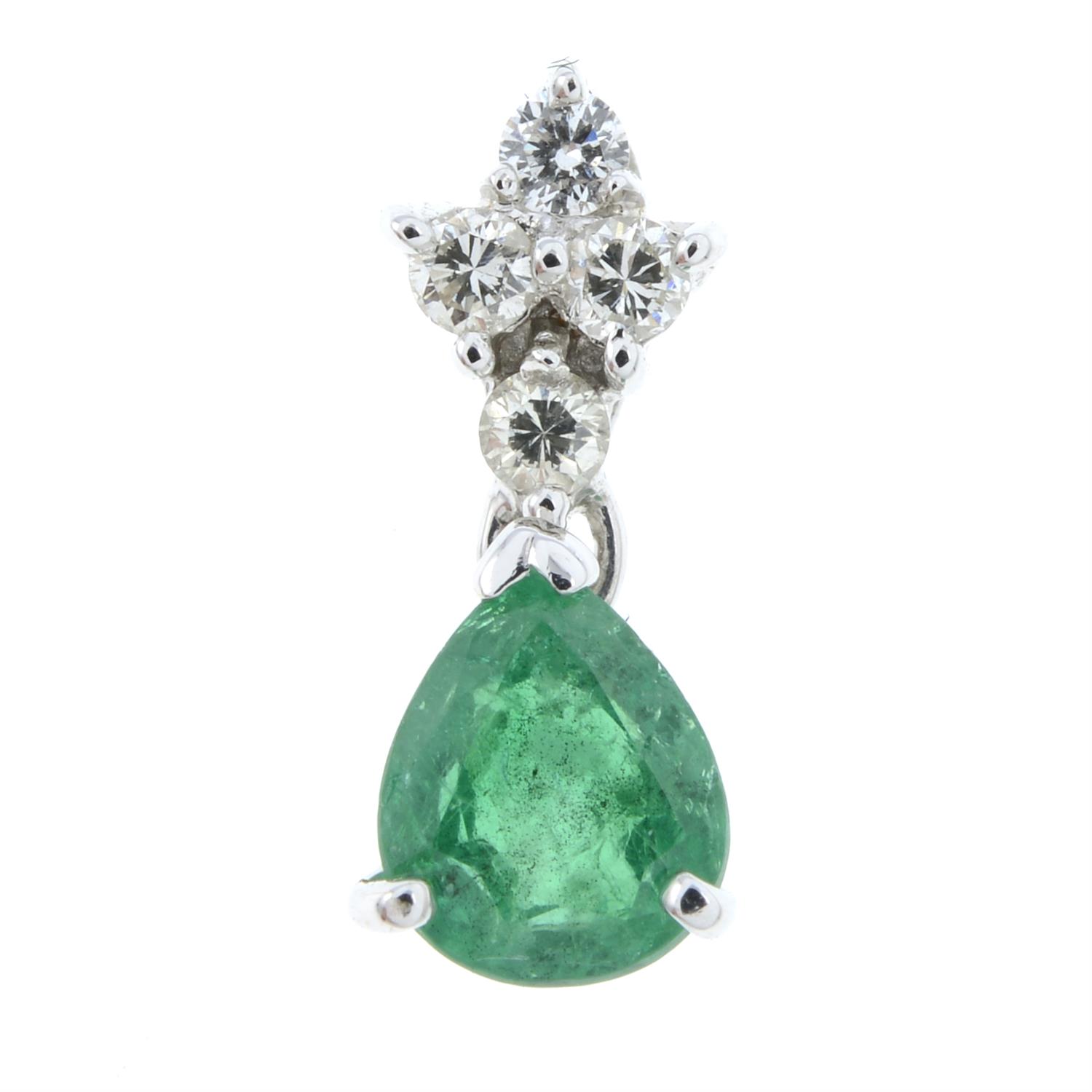 An emerald and diamond pendant.