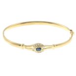 A 9ct gold bangle, with kyanite and cubic zirconia accent.