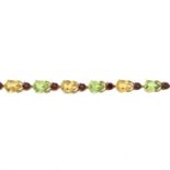 A 9ct gold periodt, citrine and garnet bracelet.