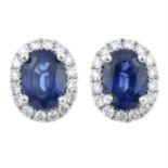 A pair of sapphire and diamond cluster stud earrings.