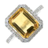 An 18ct gold citrine and diamond cluster ring.