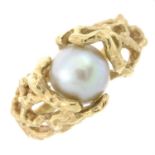 A cultured pearl dress ring.