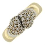 A 9ct gold diamond crossover ring, open to reveal an openwork inner band.