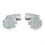 A pair of silver moonstone cufflinks, by P.D. Man.