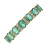 An 18ct gold emerald and diamond half eternity ring.