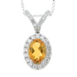 An 18ct gold citrine and diamond pendant, with trace-link chain.