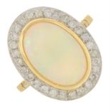 An 18ct gold opal and brilliant-cut diamond cluster ring.