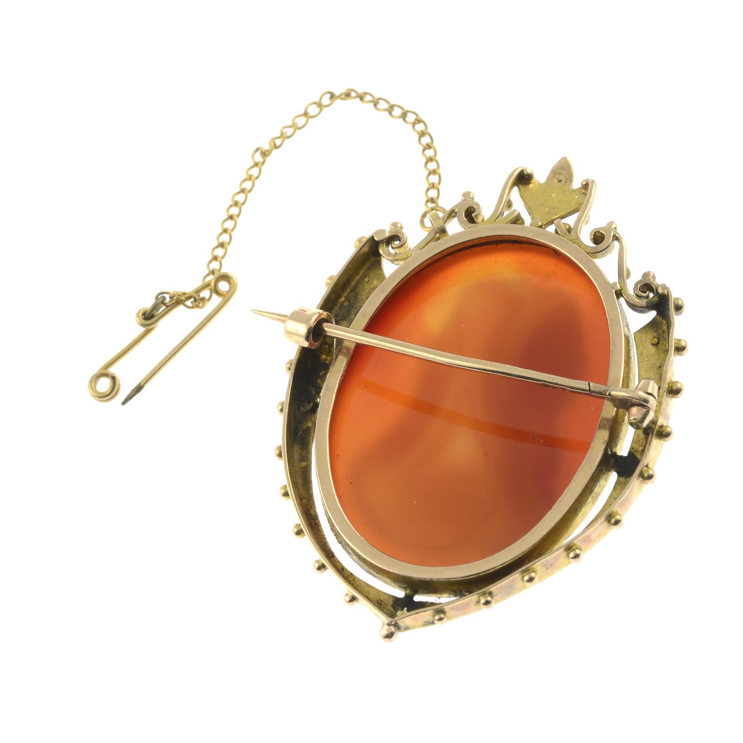 An early 20th century gold carnelian cameo and split pearl brooch, carved to depict a gentleman in - Image 2 of 2