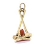 A late 19th century carnelian and coral seal fob, depicting a croquet motif.