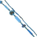 An Egyptian glazed faience bead necklace, along with three glazed faience animal motif beads.