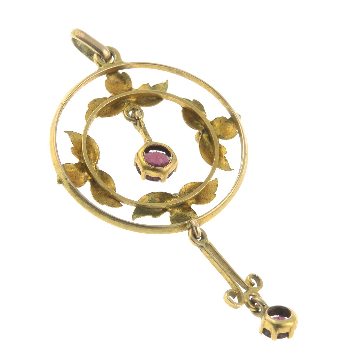 An early 20th century gold garnet accent pendant. - Image 2 of 2