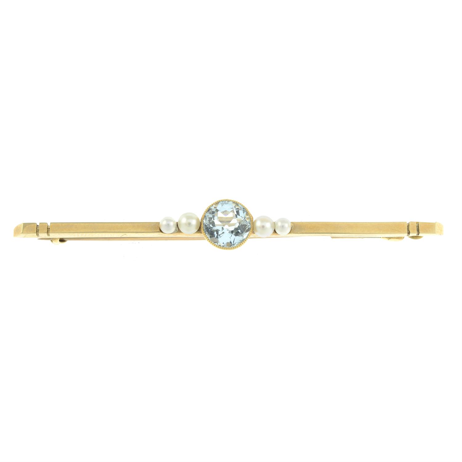 An early 20th century 15ct gold aquamarine and seed pearl bar brooch.