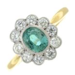 An emerald and old-cut diamond cluster ring.