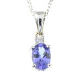 A tanzanite and diamond pendant, with trace-link chain.