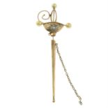 An early 20th century gold sword brooch, with seed pearl and colourless gem accents.