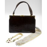 A selection of four vintage handbags, gloves and costume jewellery.