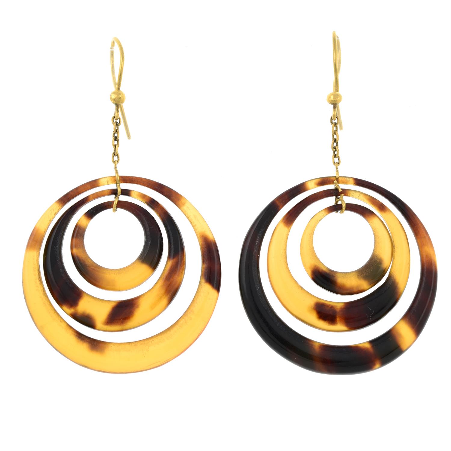 A pair of tortoiseshell drop earrings.