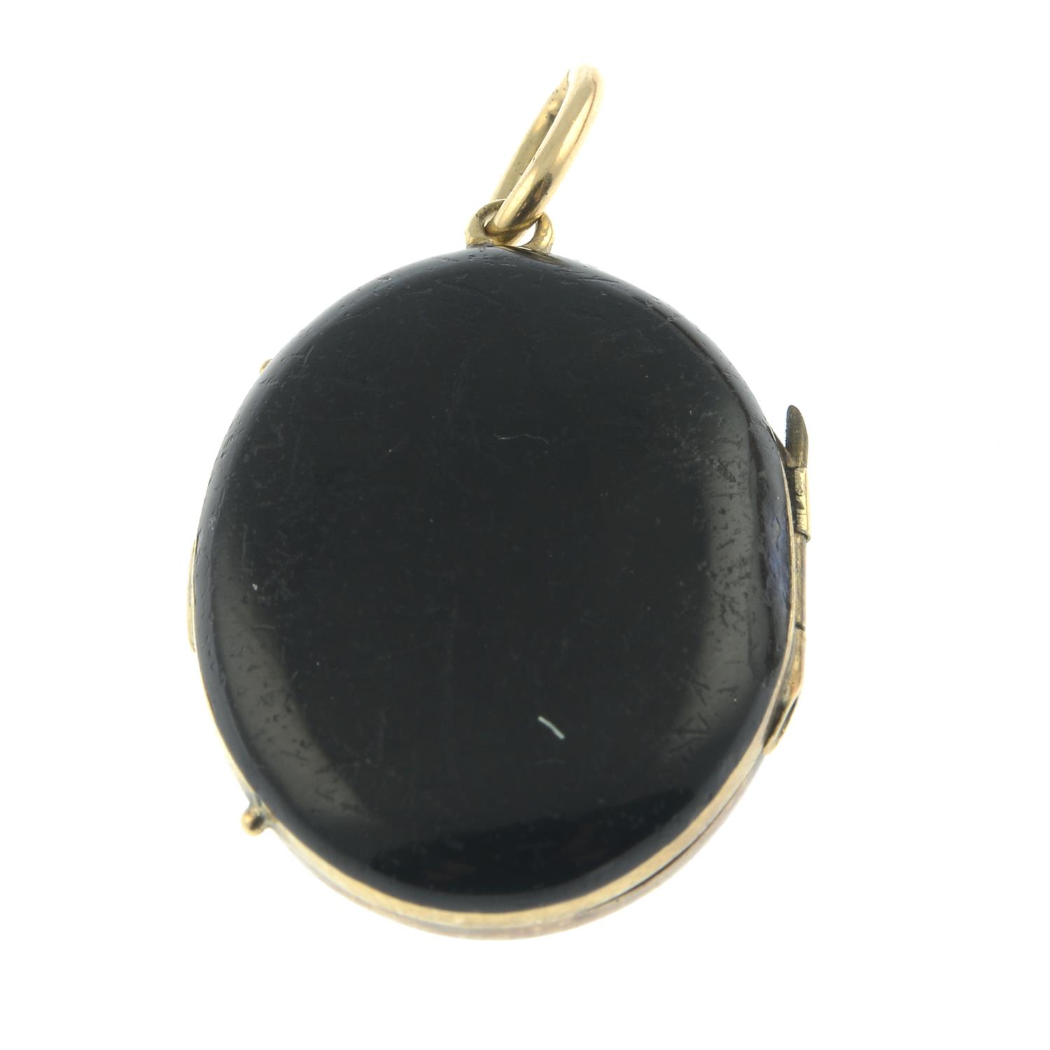 An early 20th century black enamel locket, with split pearl accent. - Image 2 of 3