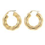 A pair of 9ct gold textured hoop earrings.