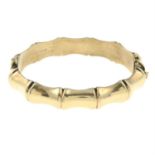 A 1960s 9ct gold bangle.