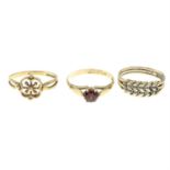 Three 9ct gold rings, one set with garnet.