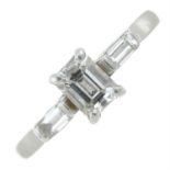 A platinum rectangular-shape and baguette-cut diamond three-stone ring.