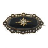 A late Victorian gold split pearl and onyx mourning brooch.