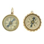 Two 9ct gold compass charms.