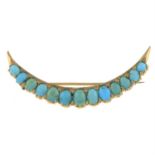 An early 20th century gold turquoise crescent brooch.