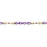 A 9ct gold amethyst and pink gem bracelet.