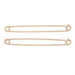 Two 9ct gold safety pins.
