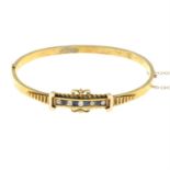An early 20th century 15ct gold sapphire and old-cut diamond hinged bangle.