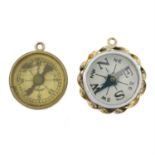 Two 9ct gold compass charms.