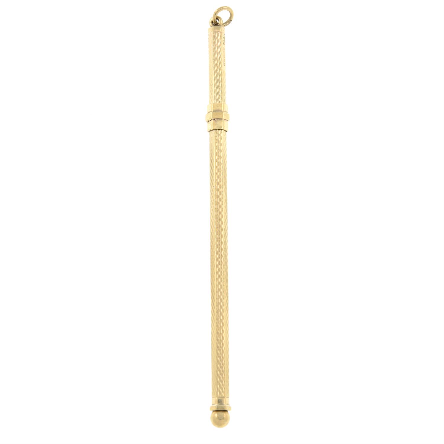 A 1960s 9ct gold cocktail stirrer.