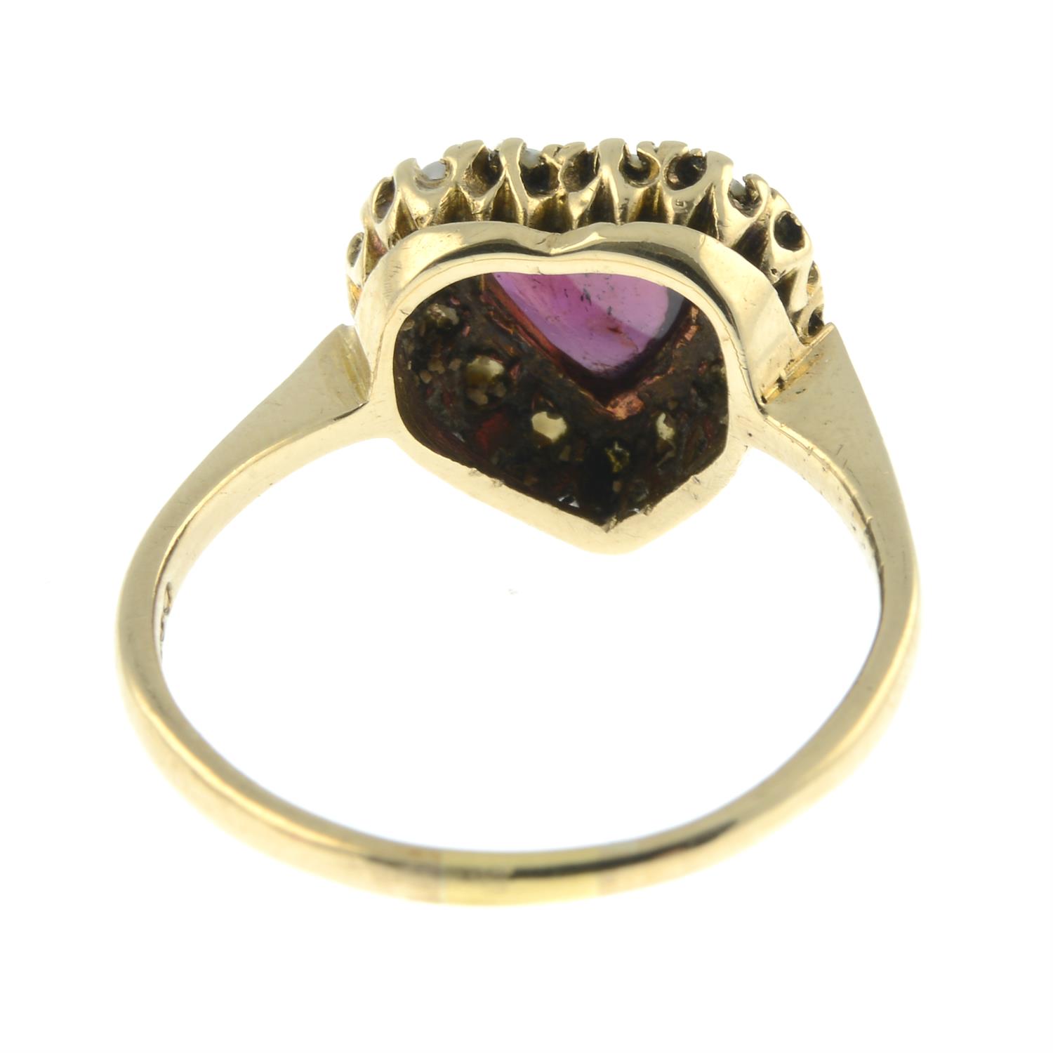 A garnet and split pearl heart ring.