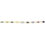 A vari-hue sapphire and ruby line bracelet.