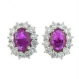 A pair of 18ct gold ruby and diamond cluster earrings.