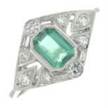 An emerald and diamond dress ring.