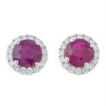 A pair of 18ct gold ruby and diamond cluster earrings.