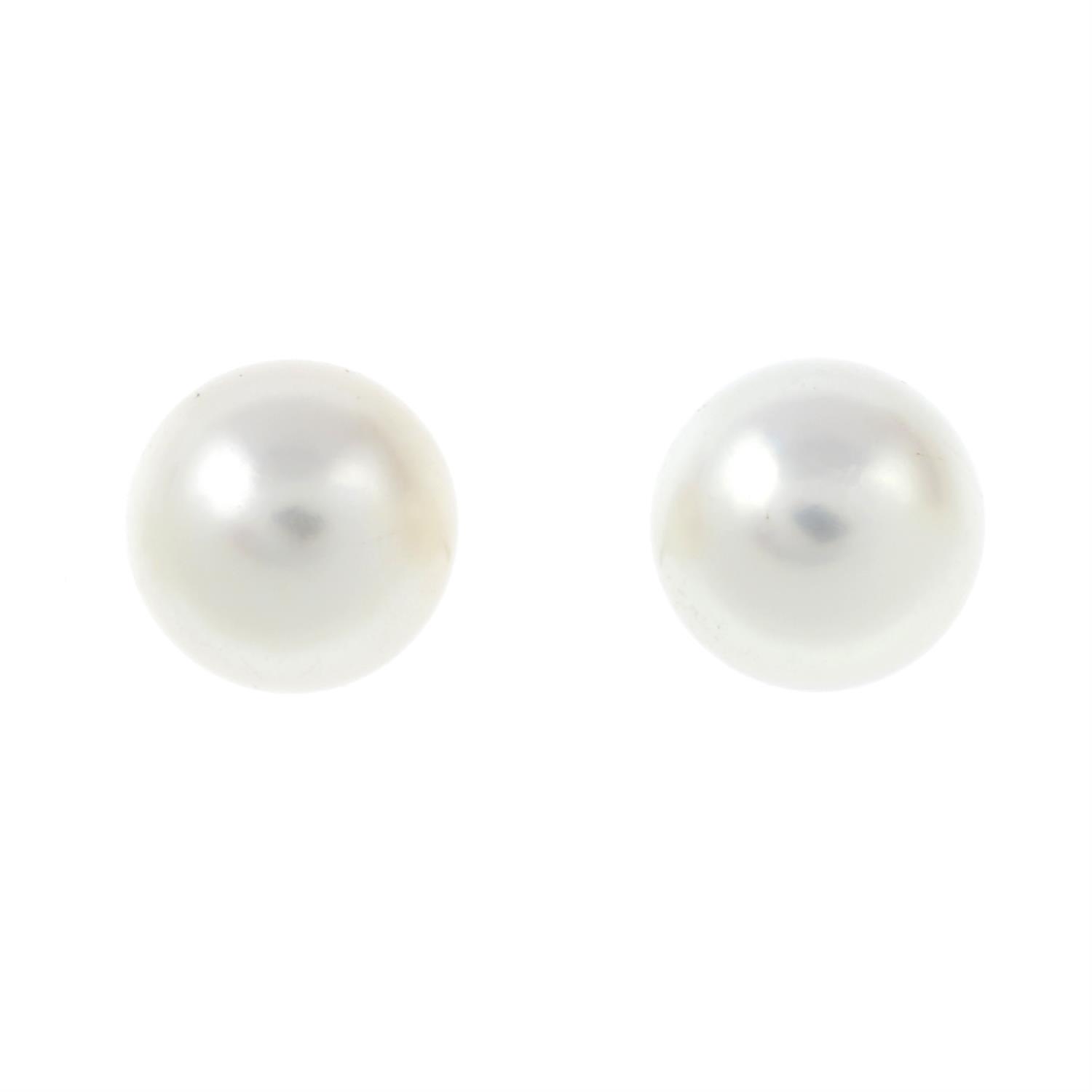 A pair of cultured pearl stud earrings.