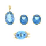 A topaz earring, ring and pendant suite.