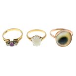 Three gem-set rings.