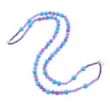 A turquoise and amethyst bead necklace.