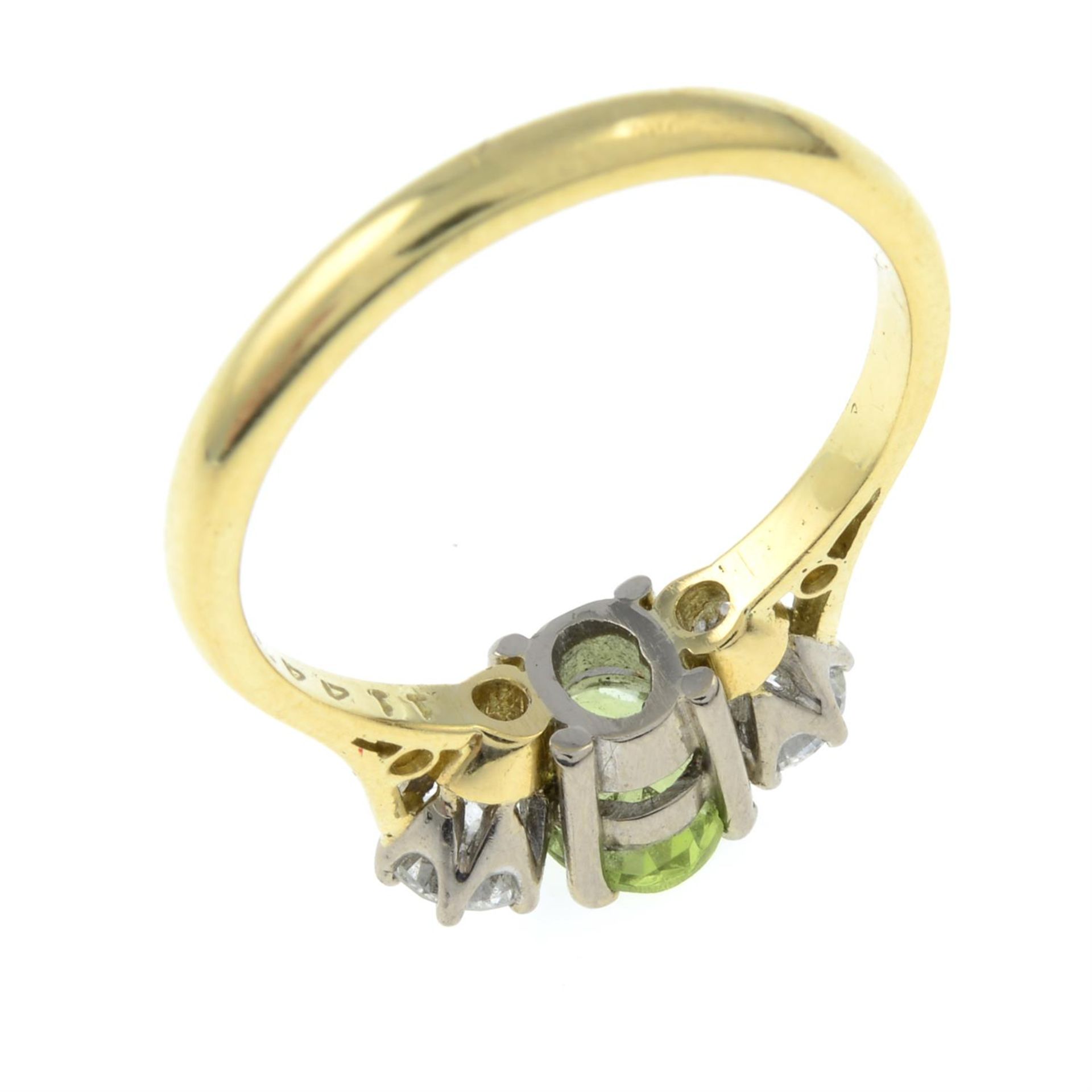 An 18ct gold peridot and diamond three-stone ring. - Image 3 of 3