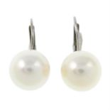 A pair of cultured pearl earrings.