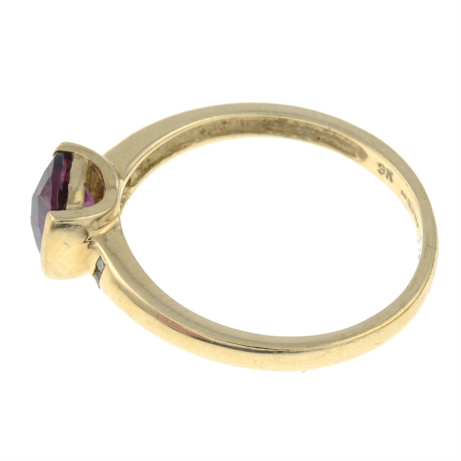 A 9ct gold garnet and diamond band ring. - Image 2 of 3